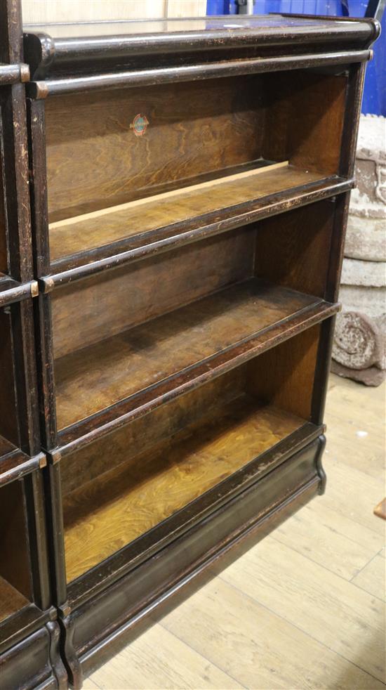 A Globe Wernicke three section open bookcase W.86cm (lacks doors)